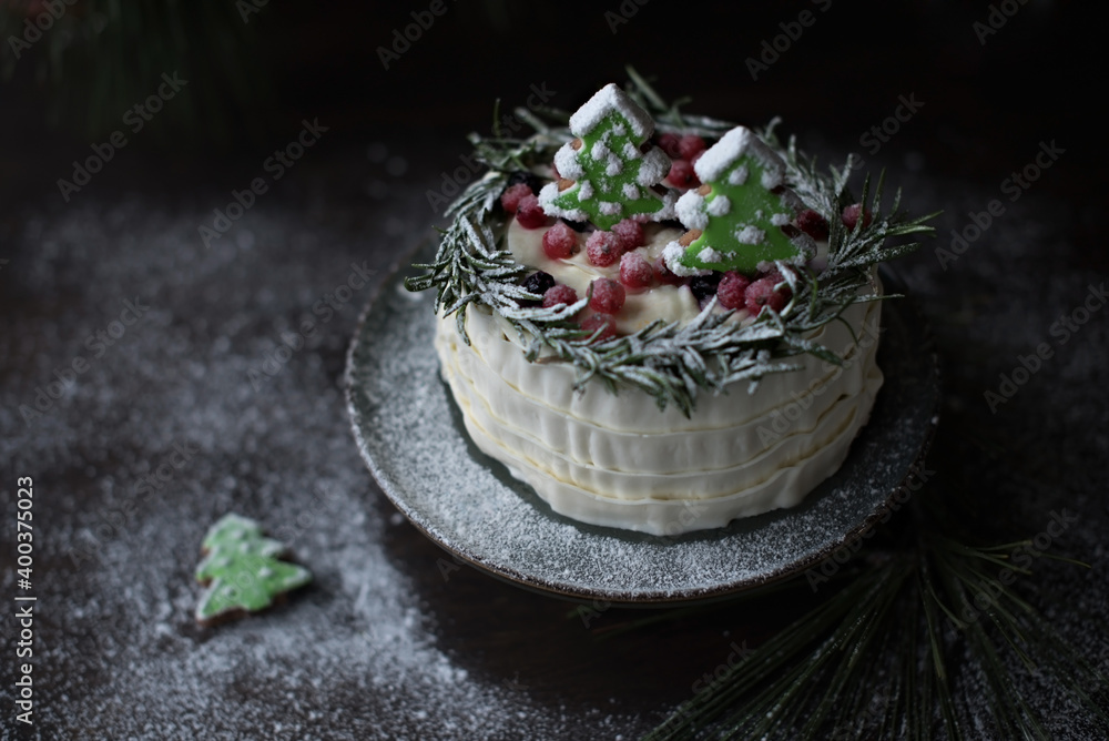 Winter cake with spruce-shaped gingerbread sprinkled with powdered sugar Winter cake with spruce-shaped gingerbread sprinkled with powdered sugar