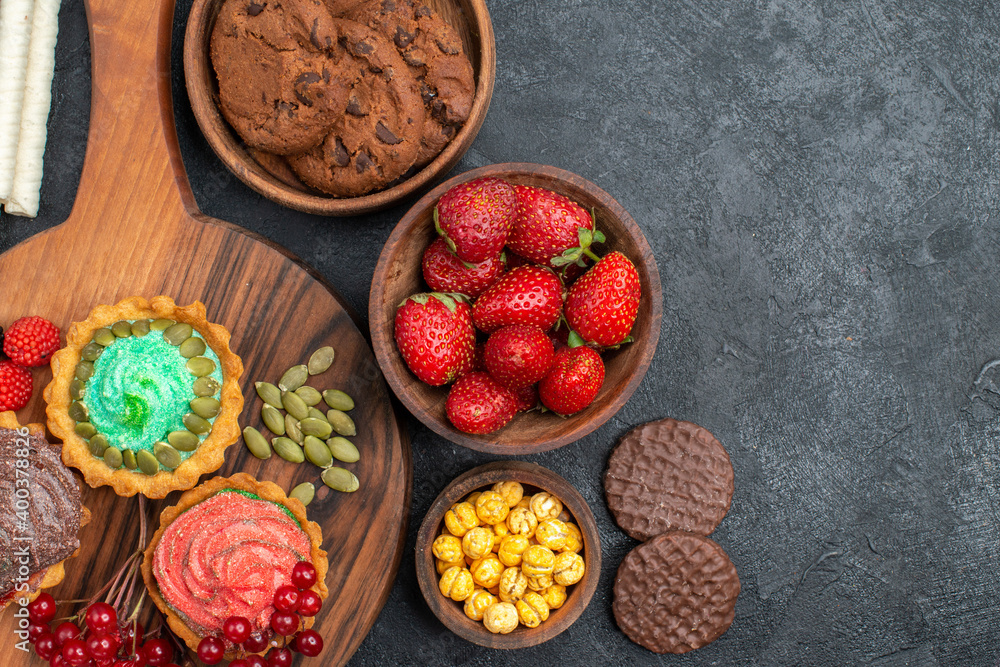 top view tasty creamy cakes with biscuits and fruits on dark background cookies sweet dessert top view tasty creamy cakes with biscuits and fruits on dark background cookies sweet dessert