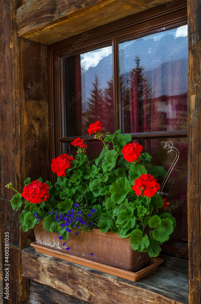 Fototapeta premium Traditional ornamented window in Selva village, Gardena valley, Dolomites, South Tirol, Italy.