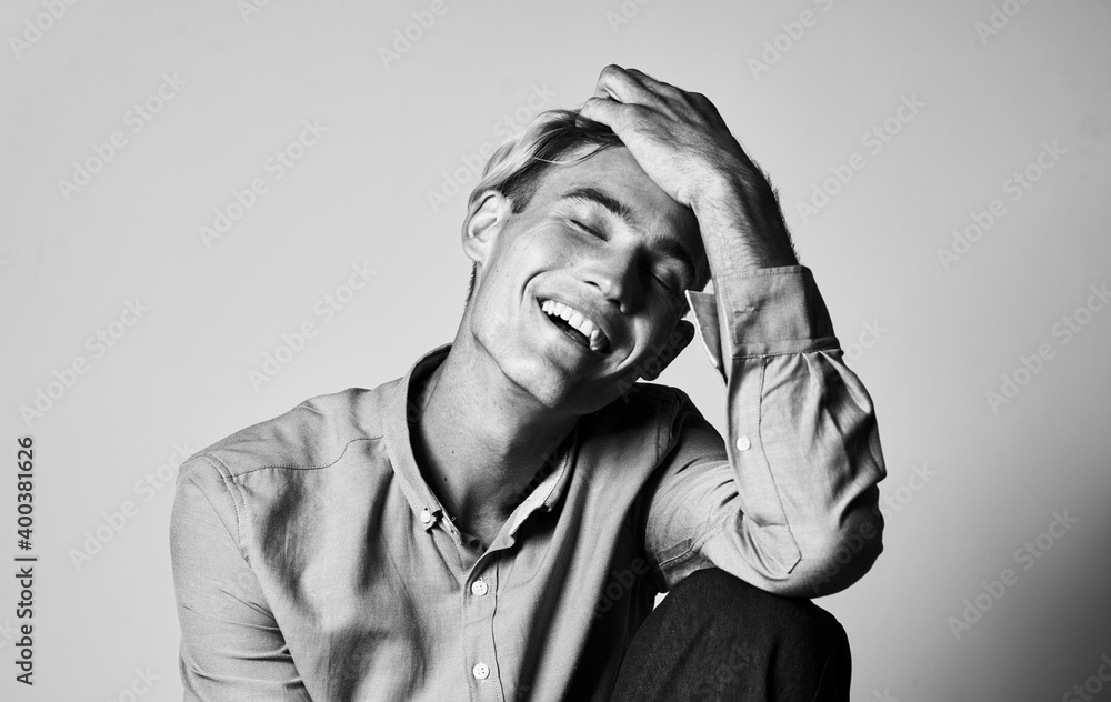 Romantic man in a shirt and trousers on a light background photograph portrait gray color Romantic man in a shirt and trousers on a light background photograph portrait gray color