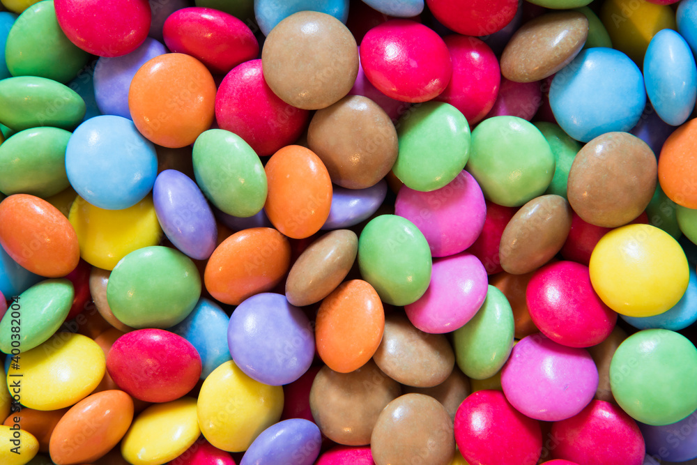 Colourful close up of sweets and candy. Coloured chocolate for desert Colourful close up of sweets and candy. Coloured chocolate for desert