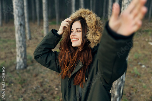 Woman in warm jacket trees walk travel lifestyle