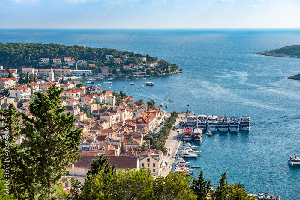 Aerial view of the medieval town of Hvar on the island of Hvar, Croatia with a bay, ships, yachts and the nearest islands in the Adriatic sea