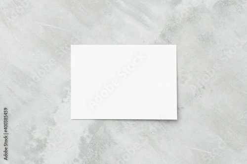 Blank white A4 paper sheet on concrete floor