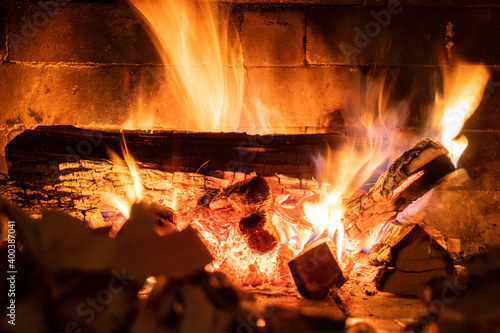 Flames in the fireplace. Burning of log. Flames of fire. Burning fireplace