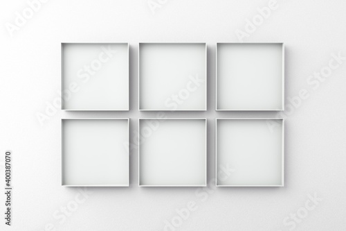 Set of 6 white frame on an empty wall