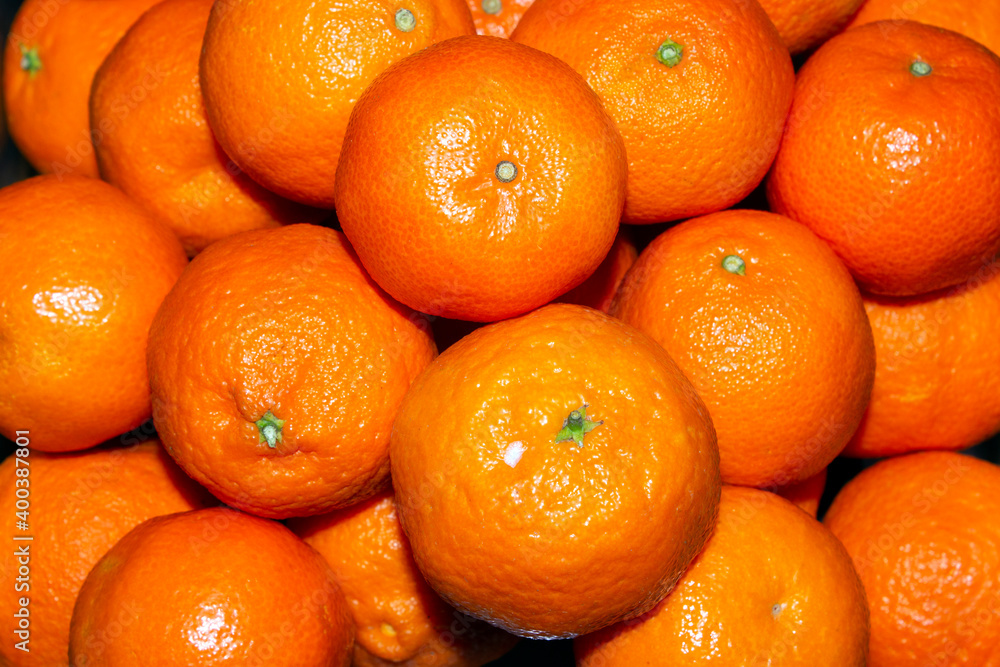 close-up on a pile of tangerines. selective focus close-up on a pile of tangerines. selective focus