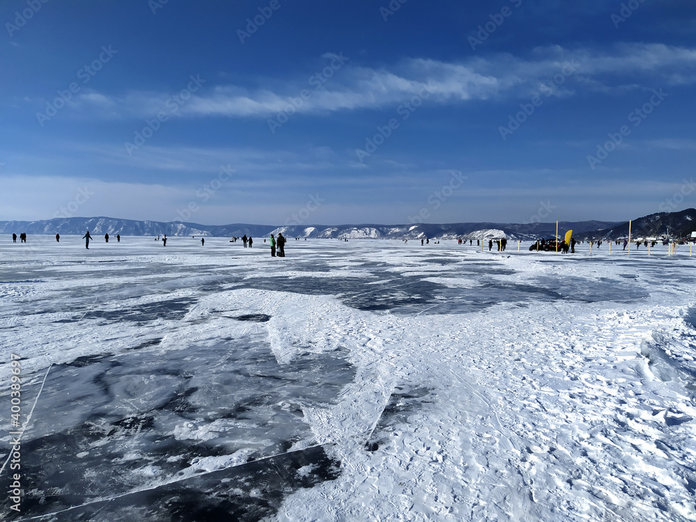 Frozen lake baikal, tourist trip in winter on baikal Frozen lake baikal, tourist trip in winter on baikal