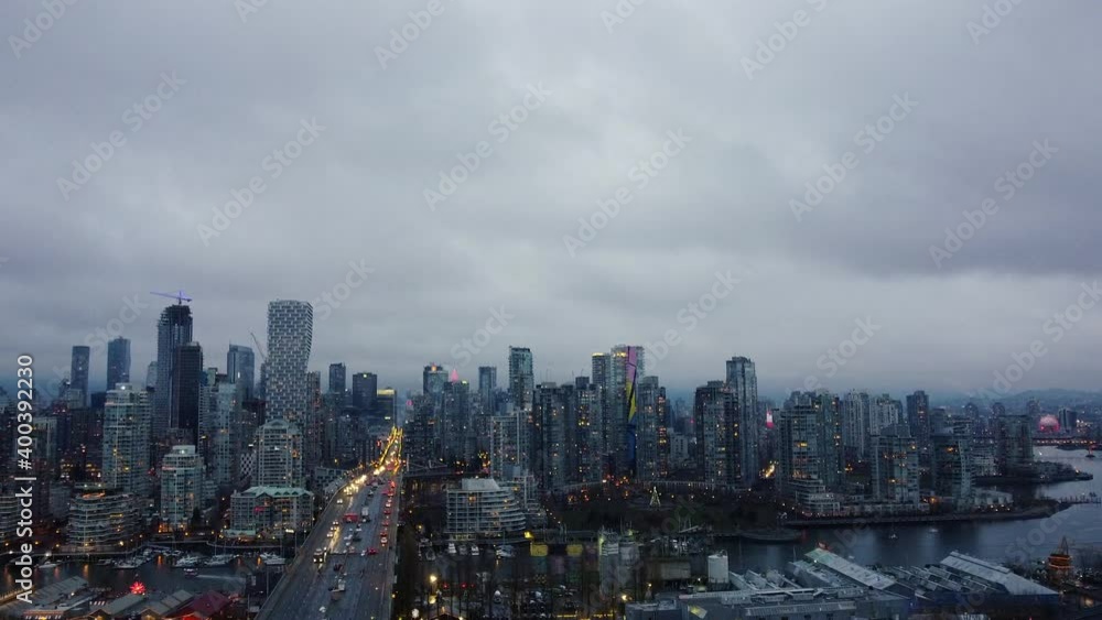Fly over the bridge towards Vancouver downtown on a cloudy evening Fly over the bridge towards Vancouver downtown on a cloudy evening