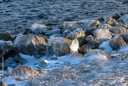 Ice rain series: ice-coverd rocks on the beach