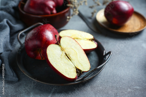 red delicious apple in metal plate