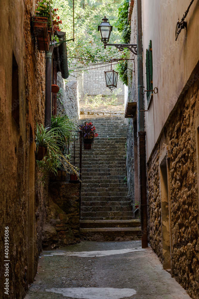 old town of volterra - italy.
Charming little tight narrow street with stairs in Volterra town in Tuscany, Italy, Europe