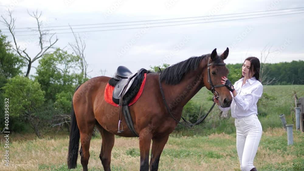 Girl with hourse. Smiling woman and her horse on the farm