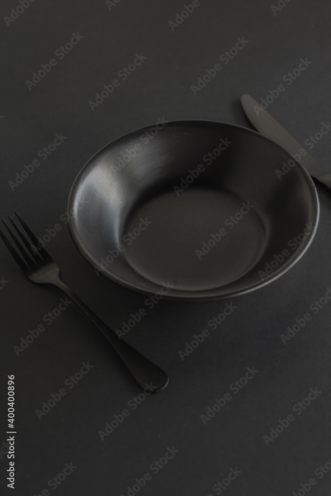 Empty dinner set on black background Empty dinner set on black background