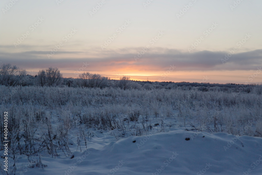 sunset over a snow field in russia sunset over a snow field in russia