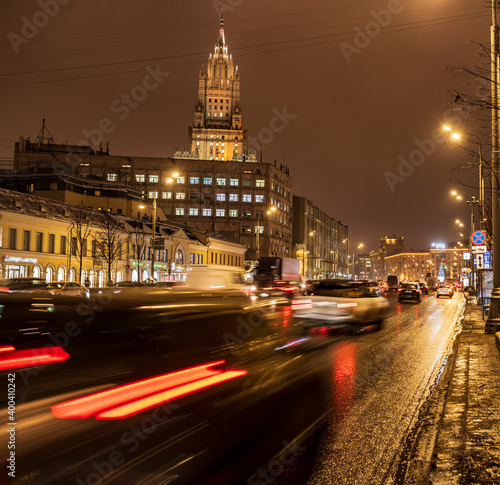 evening winter cityscape on the eve of the new year with dedicated buildings and illumination