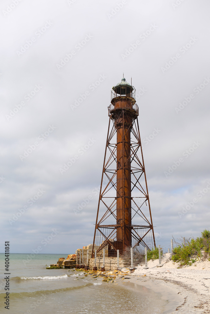 lighthouse on the sandy with grass shore of the Black Sea