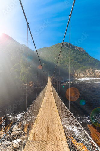 Early sunny morning at suspension bridge over Storms River Mouth, Tsitsikamma National Park - South Africa