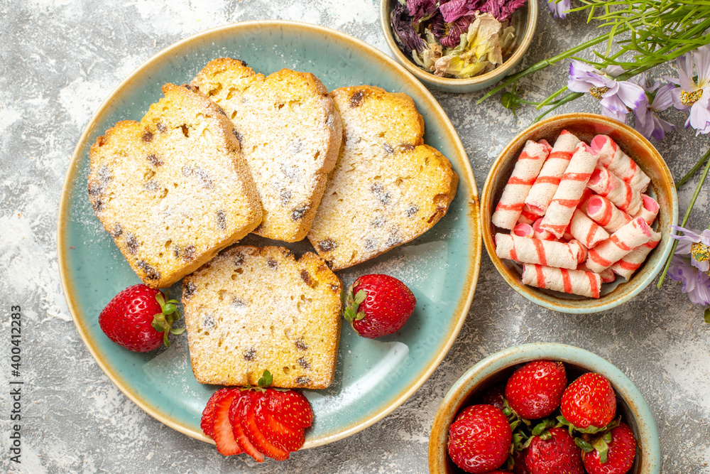 top view yummy cake slices with strawberries on a light background pie sweet cake top view yummy cake slices with strawberries on a light background pie sweet cake
