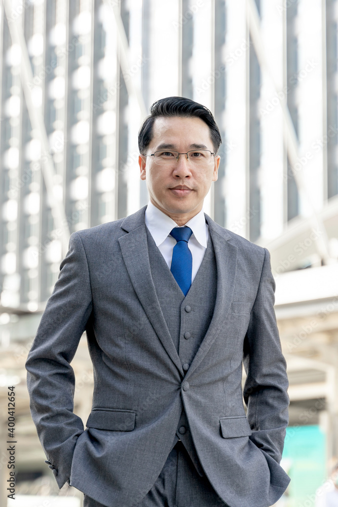Portrait asian business man business district ,senior visionary executives leader with business vision - lifestyle business people concept Portrait asian business man business district ,senior visionary executives leader with business vision - lifestyle business people concept
