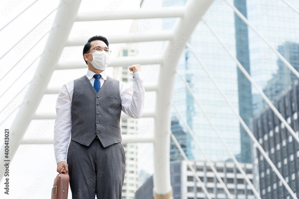 Portrait asian business man wearing protective face mask for protection during the quarantine Coronavirus covid 19 outbreak ,senior visionary executives leader with business vision Portrait asian business man wearing protective face mask for protection during the quarantine Coronavirus covid 19 outbreak ,senior visionary executives leader with business vision