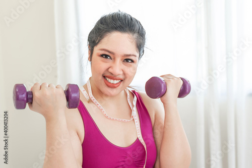 asian fat women , Fat girl , Chubby, overweight plus size Exercise with dumbbell lifting - lifestyle Woman diet weight loss overweight problem concept