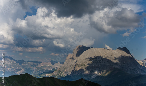 View of Sassolungo and Sassopiatto mountains as seen from Alpe di Tires refuge on a cloudy and misty evening, Dolomites, Trentino, South Tirol, Italy. © MoVia1