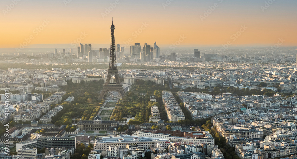 Aerial view of Paris at sunset with the Eiffel tower in background