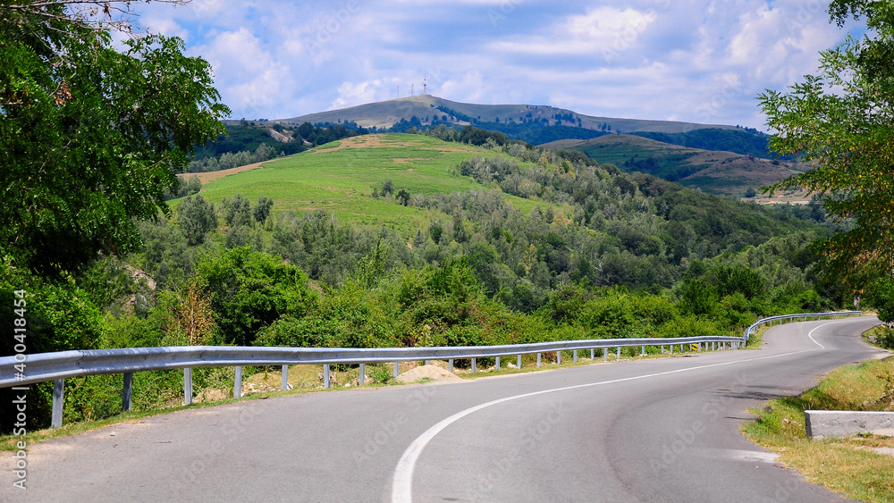 Transalpina road winding along the hills and crests of Parang Mountains. Carpathia, Romania.