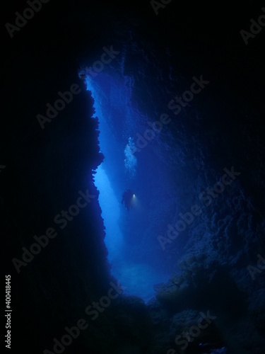 scuba divers are exploring the caves and caverns underwa photo