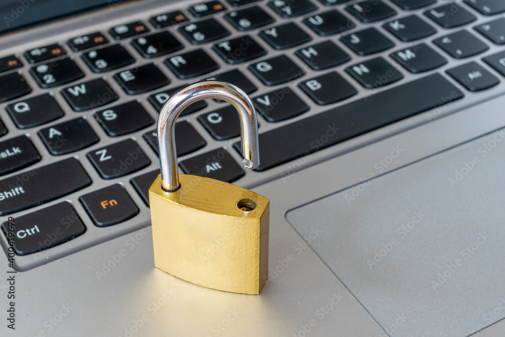 padlock open on the keyboard. Hacker attack, concept of information leak. padlock open on the keyboard. Hacker attack, concept of information leak.