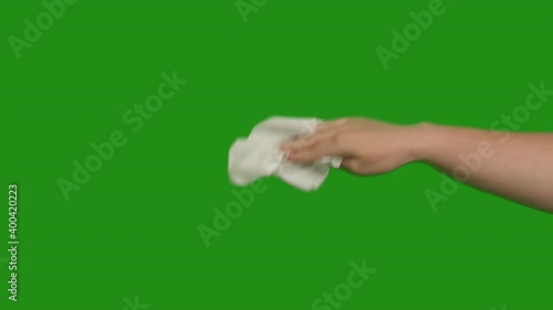 Female hand with a white napkin, wipes, close-up, chromakey
