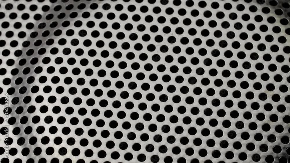 Rotated perforated steel surface background. Rotated perforated steel surface background.
