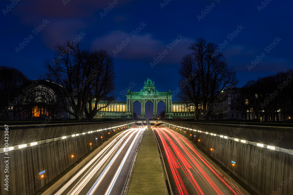 Arcade du Cinquantenaire in Brussels at sunset with the traffic passing in a tunnel underneath