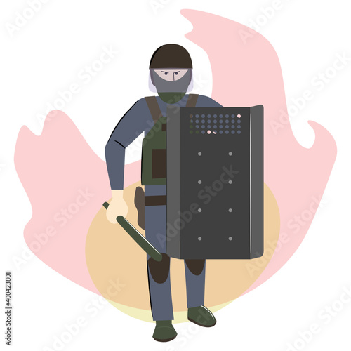 A riot policeman with a shield and a baton against the background of the flame.
