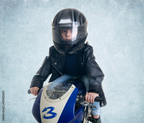 kid driving his motorcycle photo