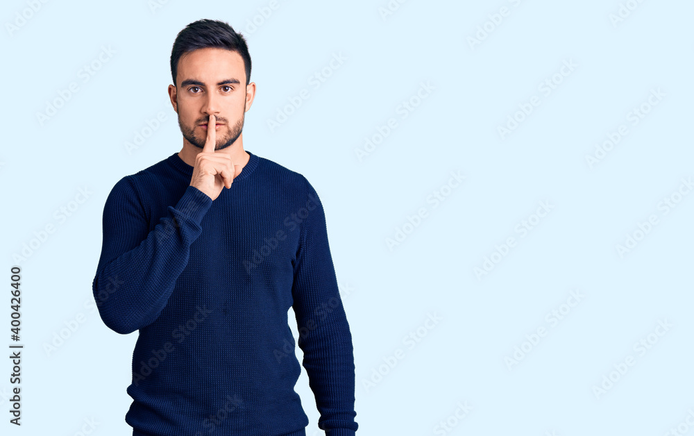 Young handsome man wearing casual clothes asking to be quiet with finger on lips. silence and secret concept. Young handsome man wearing casual clothes asking to be quiet with finger on lips. silence and secret concept.