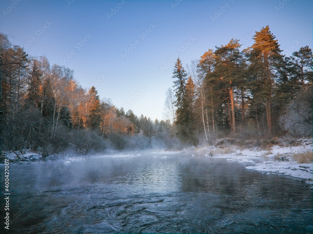 Winter landscape the river in the forest at sunset. Winter sunset rural river landscape. Winter landscape the river in the forest at sunset. Winter sunset rural river landscape.
