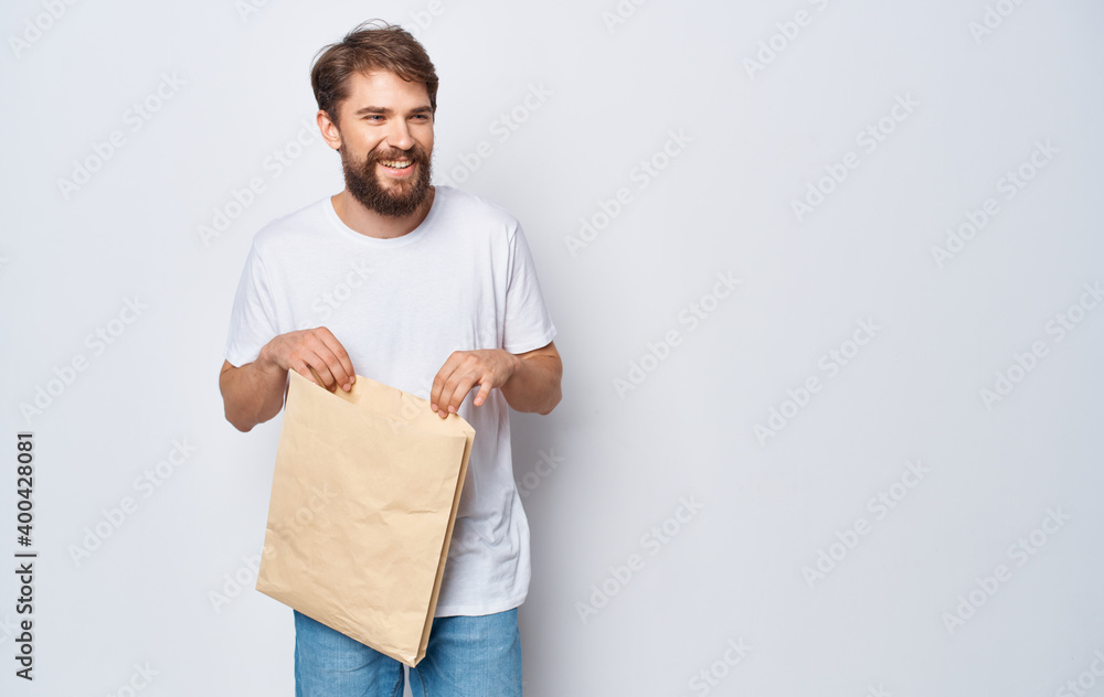Nice man with a package in his hands shopping packing Shopping Nice man with a package in his hands shopping packing Shopping