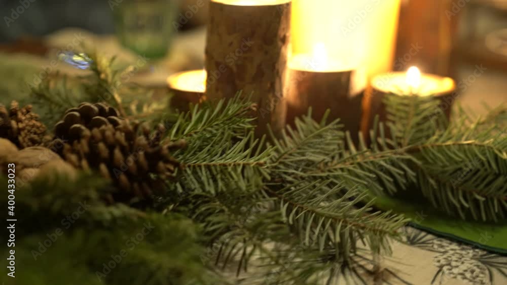 Festive Christmas table setting Spruce twigs, pumpkins, candles, romantic mood. Festive Christmas table setting Spruce twigs, pumpkins, candles, romantic mood.