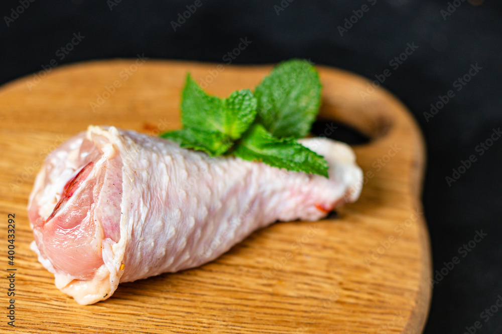 Chicken leg meat raw skin bones broiler fresh piece on the table healthy meal ingredient top view copy space for text food background rustic image Chicken leg meat raw skin bones broiler fresh piece on the table healthy meal ingredient top view copy space for text food background rustic image