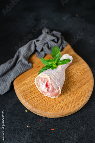 Fototapeta Naklejka Na Ścianę i Meble -  Chicken leg meat raw skin bones broiler fresh piece on the table healthy meal ingredient top view copy space for text food background rustic image
