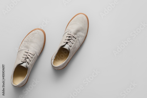 Wallpaper Mural Pair of casual male shoes on light background Torontodigital.ca