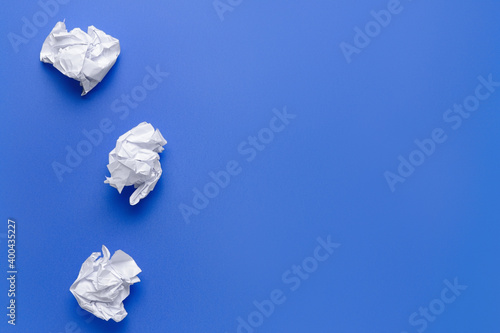 Crumpled paper on color bac...