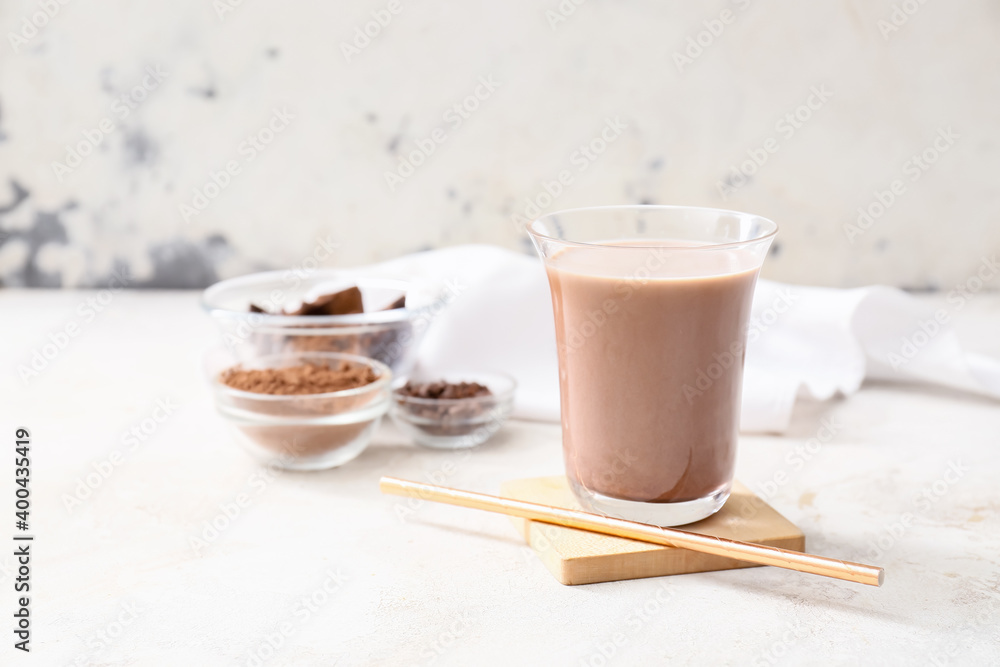 Glass of tasty chocolate milk on table Glass of tasty chocolate milk on table