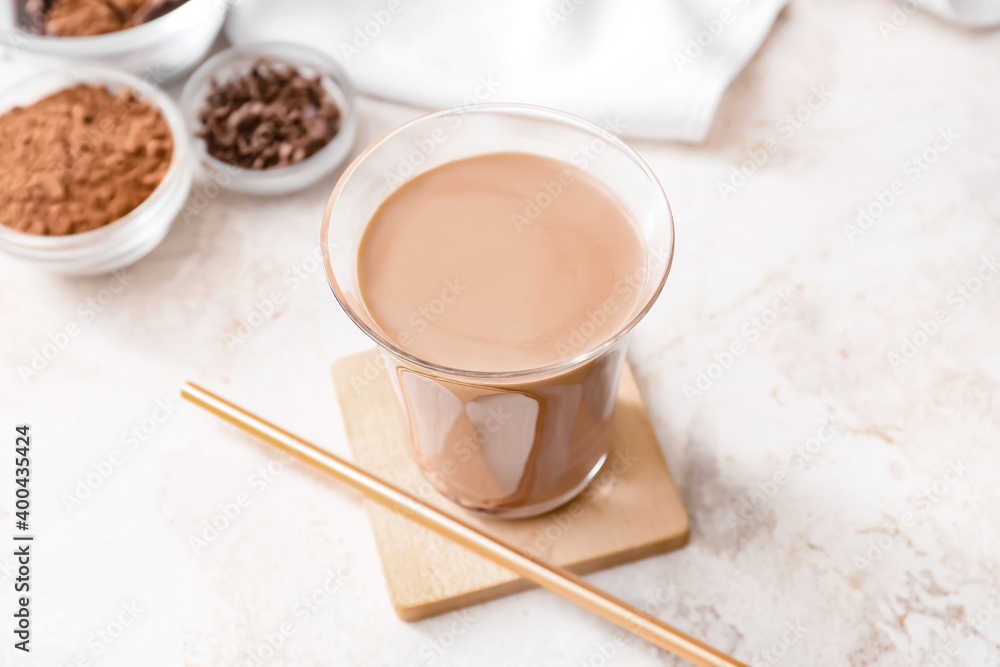 Glass of tasty chocolate milk on table Glass of tasty chocolate milk on table