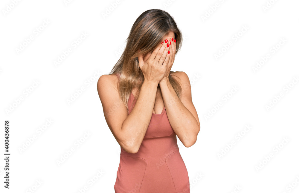 Beautiful caucasian woman wearing casual clothes with sad expression covering face with hands while crying. depression concept. Beautiful caucasian woman wearing casual clothes with sad expression covering face with hands while crying. depression concept.