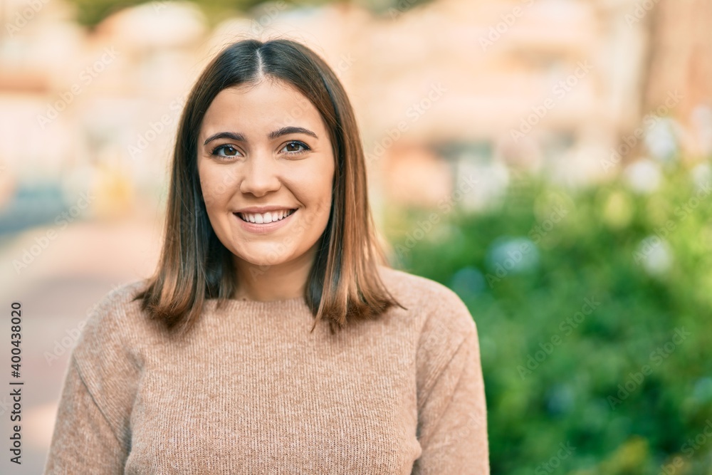 Young hispanic woman smiling happy standing at the city. Young hispanic woman smiling happy standing at the city.