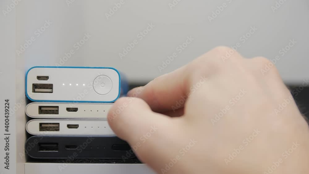Mobile power banks charge indicator man hand closeup 4 power supply Mobile power banks charge indicator man hand closeup 4 power supply