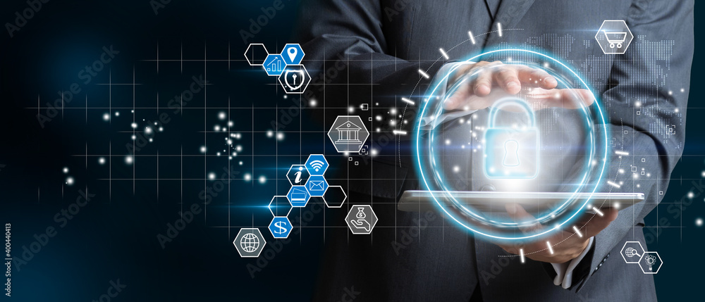 Obraz premium Businessman with digital table holding padlock icon and internet technology networking. Businessman protecting data personal information. Data protection privacy concept and Cyber security network.